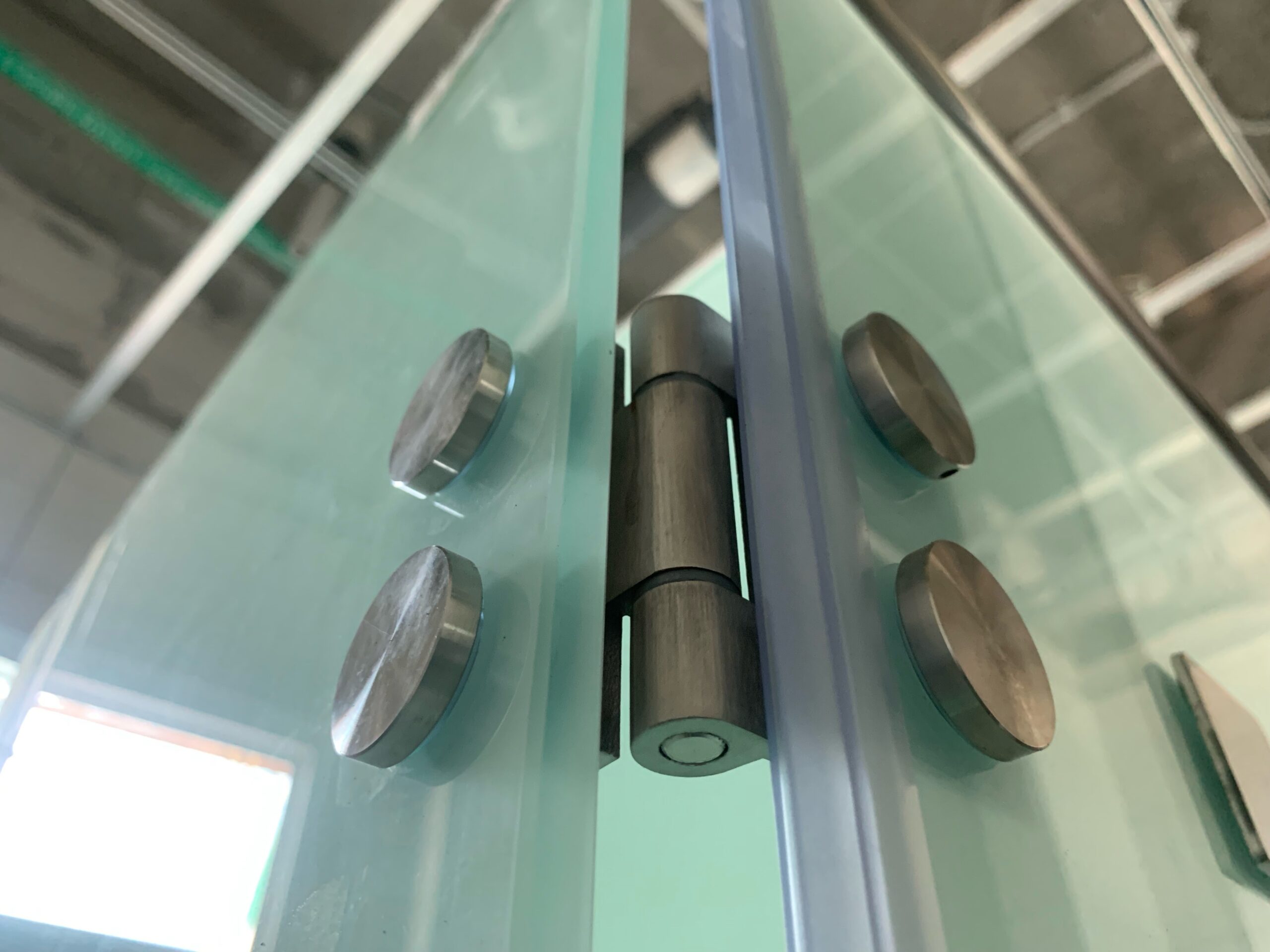 Toilet cubicle hinges and leg supports